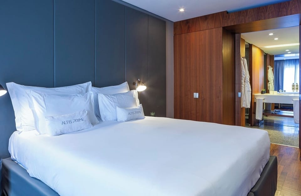 Unwind in a serene king bed with hotel-soft linens.