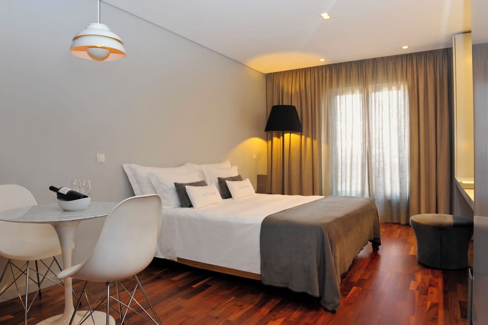 Sip morning coffee beside crisp linens and warm wood floors.
