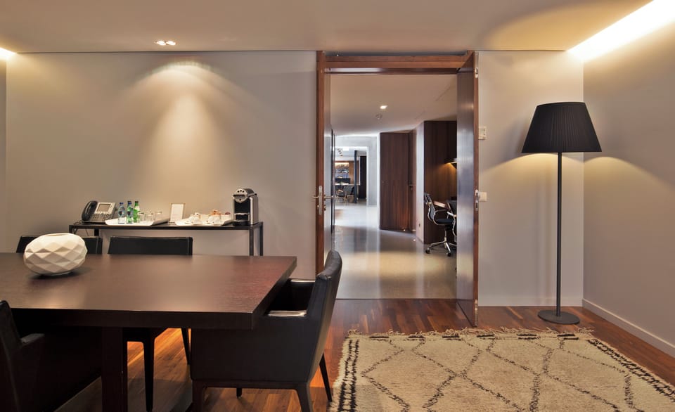 Gather for relaxed meals with coffee station and warm lighting.