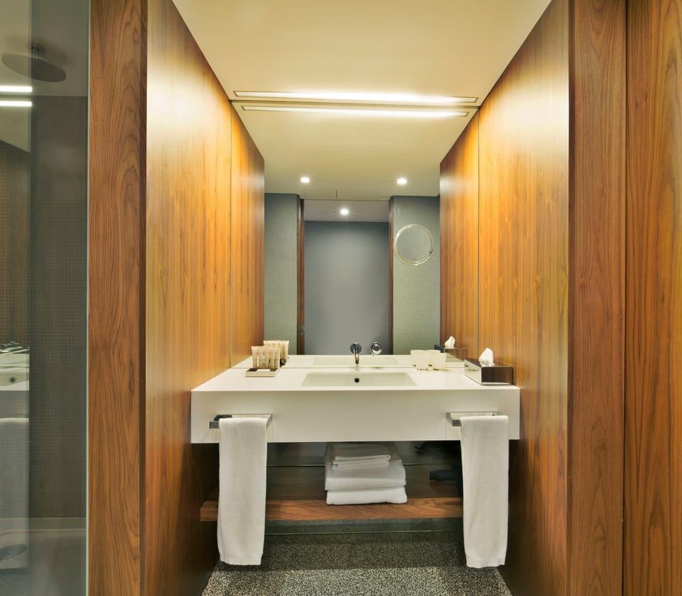 Refresh in a spa-like vanity area with plush folded towels.