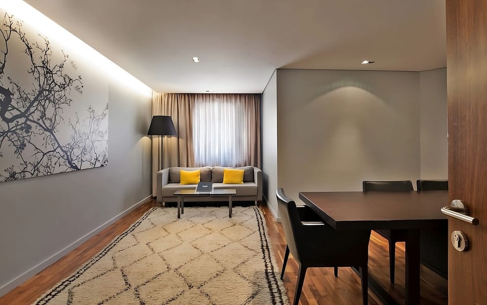 Unwind on the cozy sofa in this calm, modern lounge.