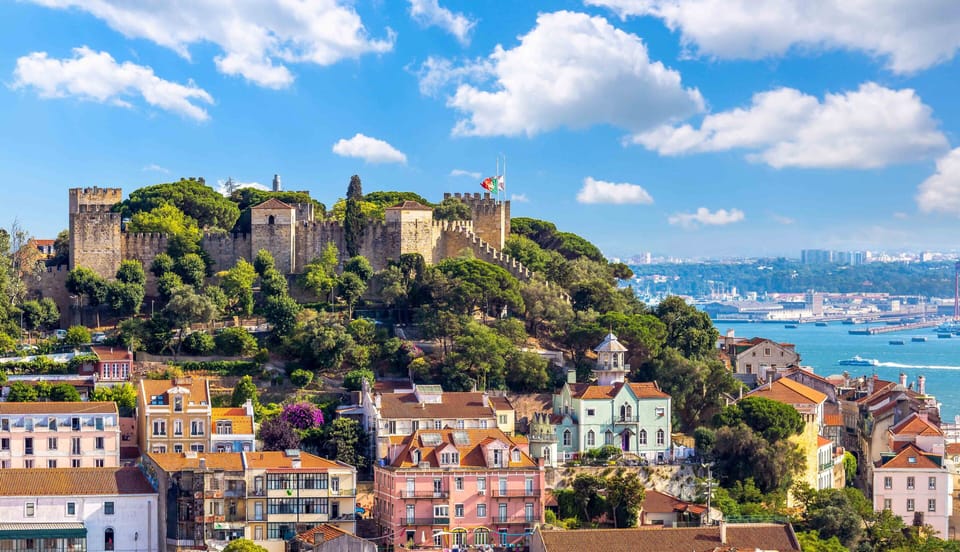 Soak in colorful city rooftops and hilltop castle views.