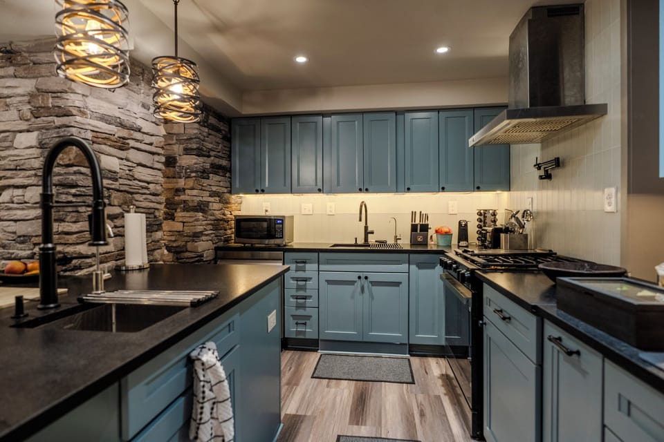 Alcove Gourmet Kitchen with tons of appliances, main sink, island prep sink, gas oven, microwave, dishwasher, French Door refrigerator, two (2) filtered water stations, pot filler and coffee & tea station.