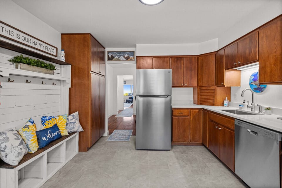 From the entryway to the kitchen, this open layout flows naturally into the living areas, inviting you to linger and connect.