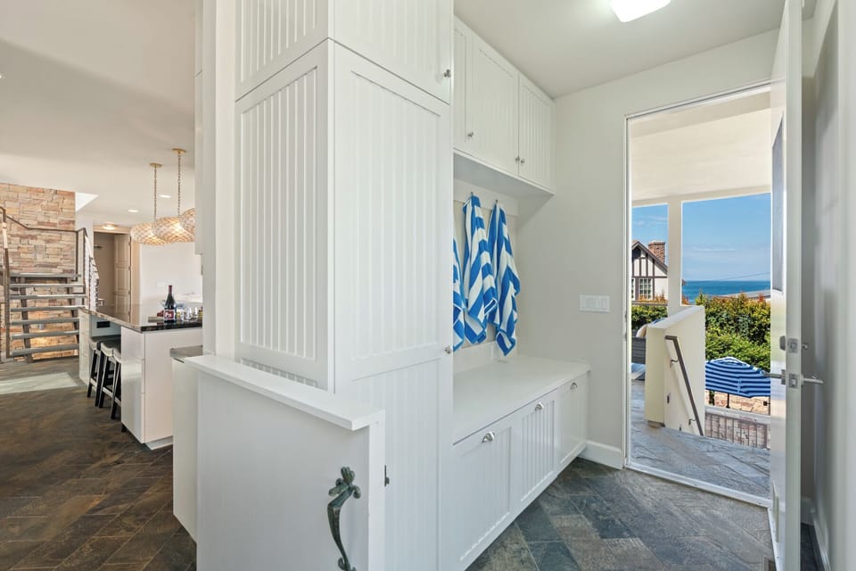 Storage Area Off Kitchen and Stairs to Pool.