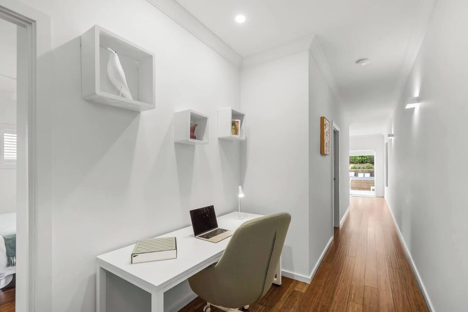 Catch up on work at the dedicated workspace in the hallway, perfect for focused remote work or trip planning.