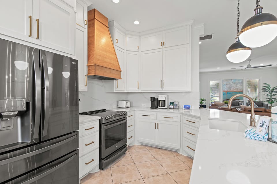 Your fully equipped kitchen awaits with modern appliances, sleek countertops, and warm copper accents for memorable meal preparations.
