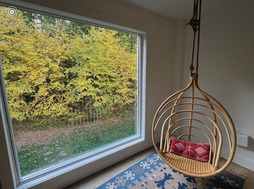 Float above the trees, the dreamiest seat for sunrise coffee.
