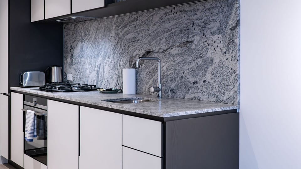 Open kitchen with stone benchtops