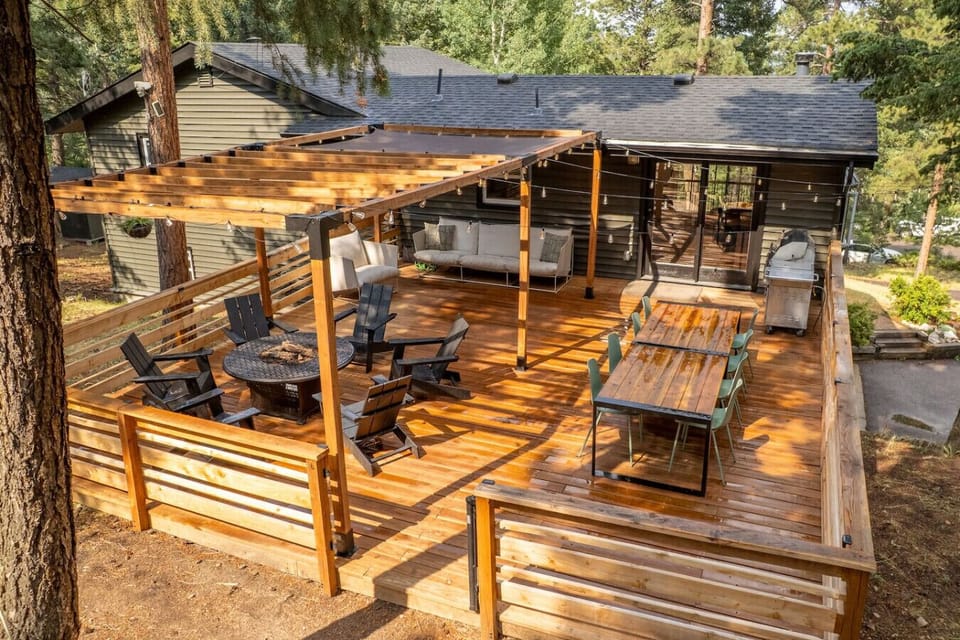 Enjoy time outdoors on the huge deck with plenty of seating, fire pit, and lighting