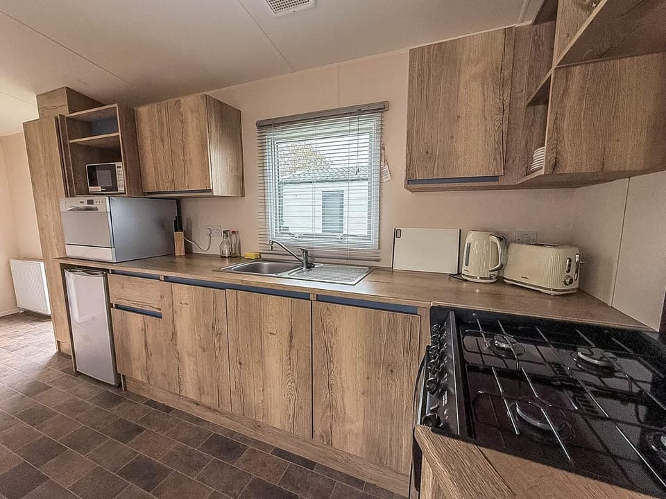 Compact yet equipped open caravan kitchen for all of your culinary needs