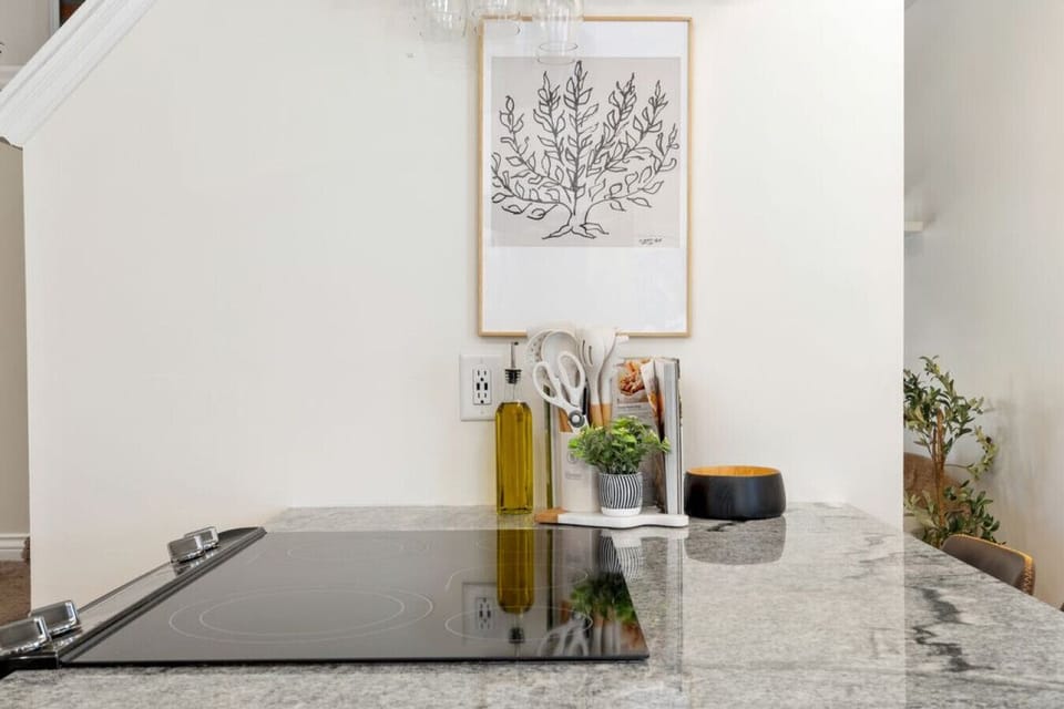 Cooktop with prep space and essential cooking tools provided.