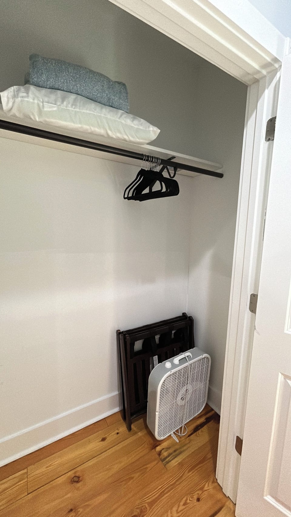 Bedroom 1 closet with spare sheets for twin trundle