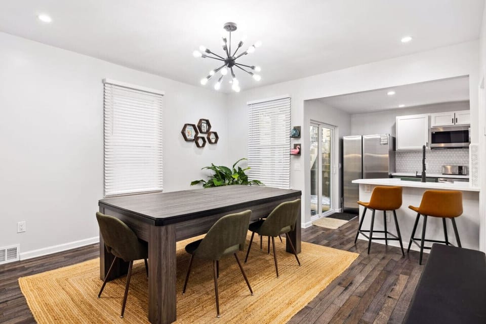 Dining for 8 and the huge table. Enjoy comfortable midcentury chairs or one or two padded bench seats. Plenty of room for everyone.