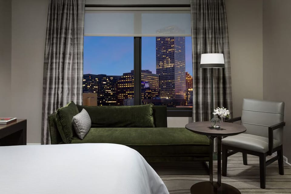 Sip a nightcap beside twinkling downtown lights and comfort.