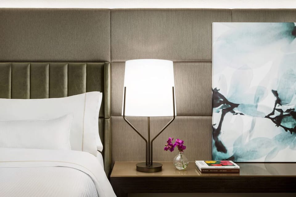 Enjoy thoughtful touches with warm lighting and modern art.