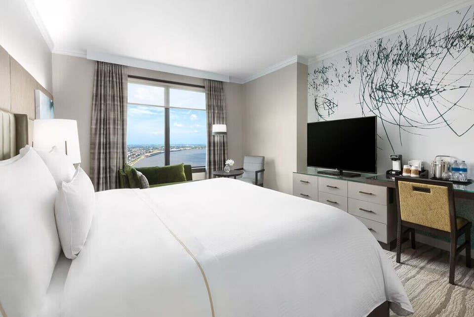 Wake up to sunshine and river views from plush bedding.