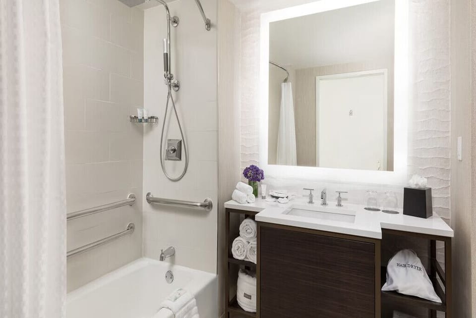 Refresh under a spa-style shower with plush towels.