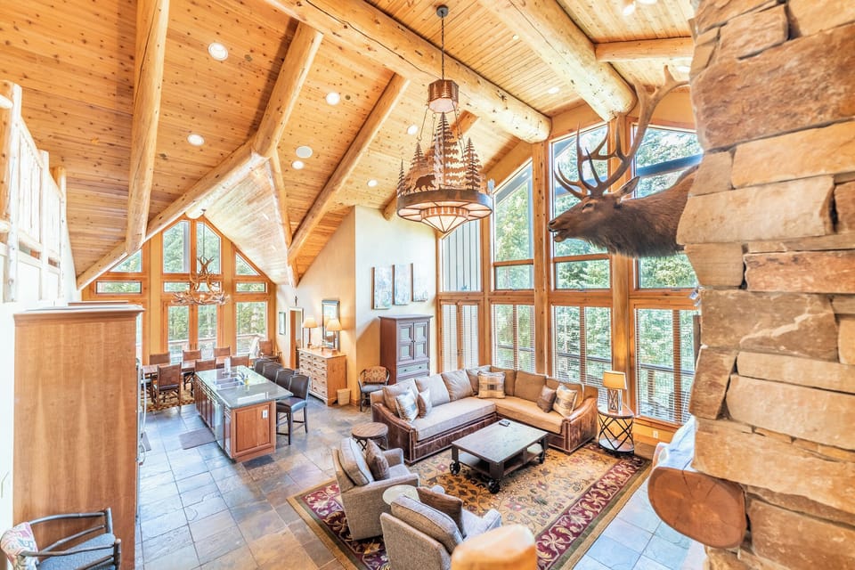 With floor to ceiling windows & 25 ft lodgepole pine ceilings, enjoy the views!