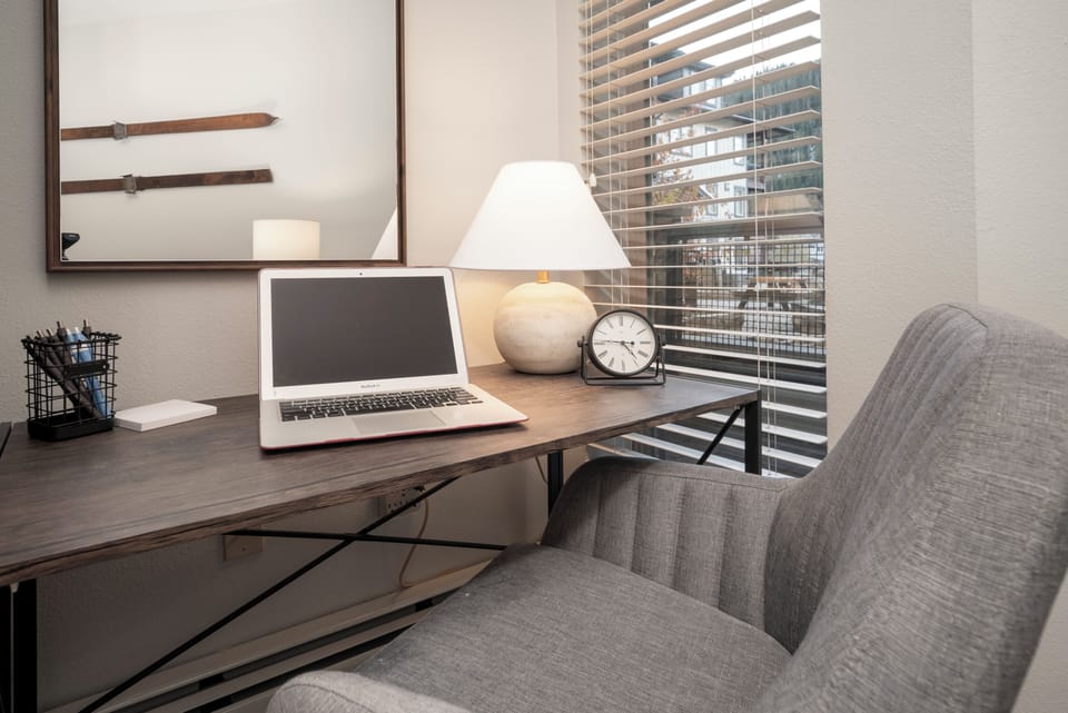 Cozy workstation situated by the fireplace and outside views + wifi