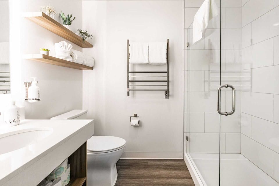 Clean elegant bathroom with cozy towel heaters!