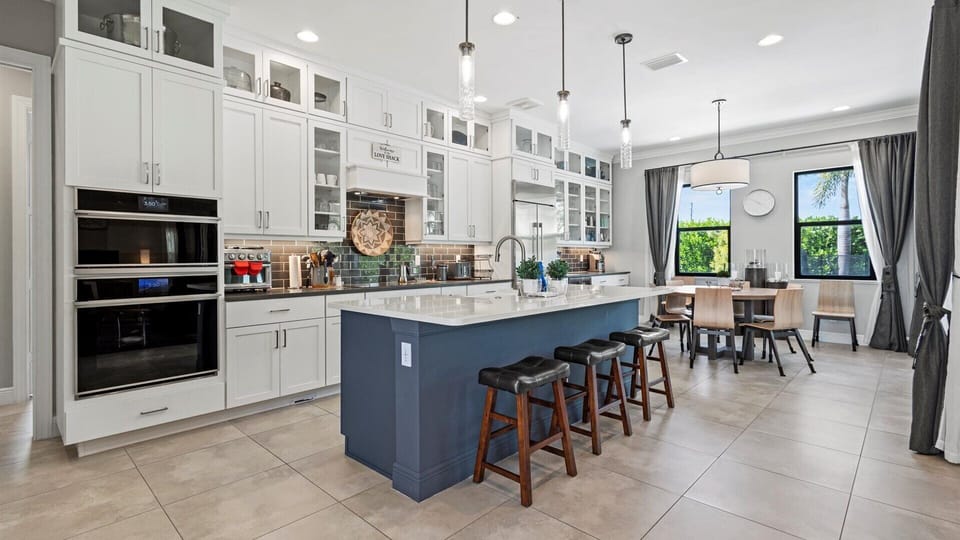 The kitchen opens to the living room and dining area to enjoy time with family and friends in one space.
