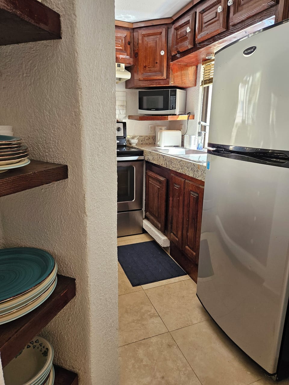 Kitchen view with fridge