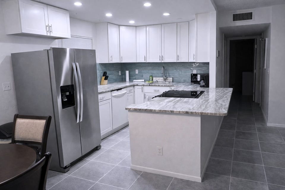 kitchen with solid countertops and stainless steel appliances