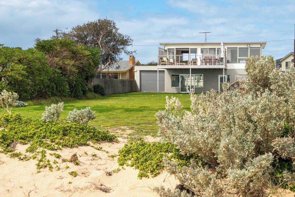 GUESTS LOVE Backyard beach access, the rumpus games room that kids never want to leave, the sweeping bay views from every living space, and relaxing on the deck with sunrise coffees and sunset drinks
