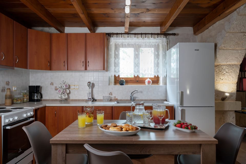 .A fully equipped well lit kitchen space where culinary creativity meets convenience.