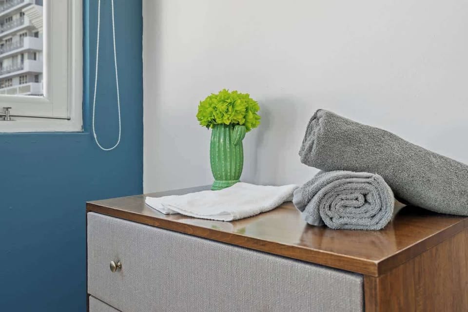Enjoy fresh towels and a touch of nature with this inviting bathroom detail.