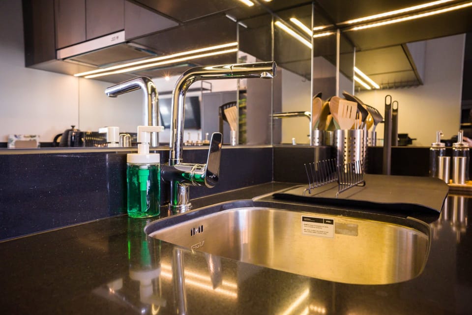 Sleek and modern kitchen with high-end fixtures, perfect for culinary enthusiasts.