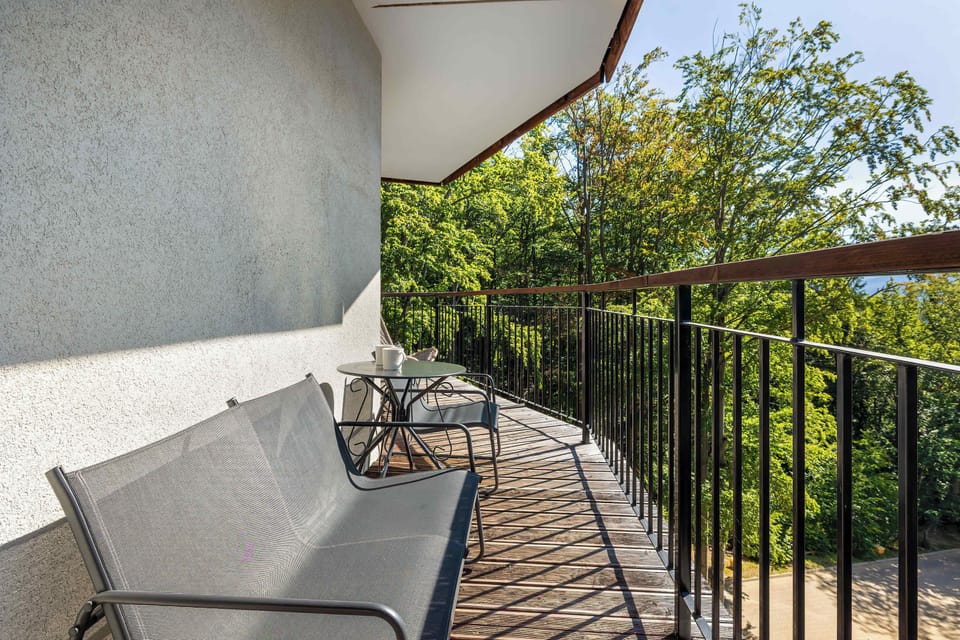 The modern chairs on the terrace make every moment outdoors exceptionally comfortable.