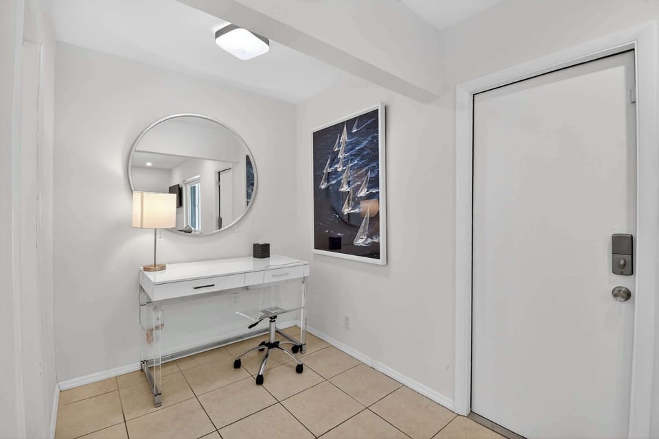 Bedroom 2 with queen bed, Smart TV, ensuite, and patio
