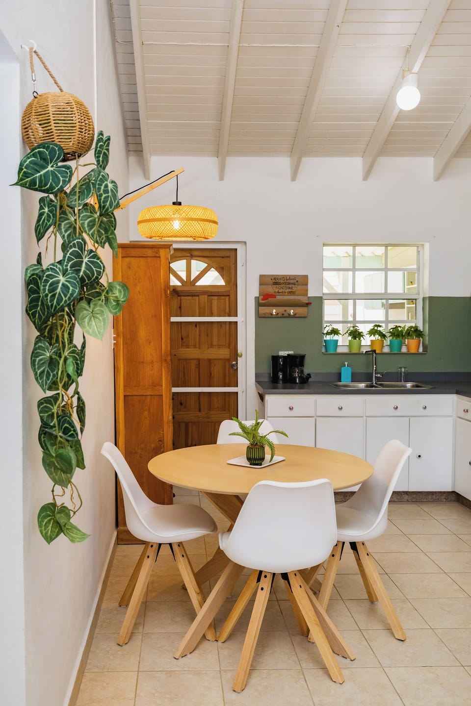 Open kitchen and dining area with tropical accents