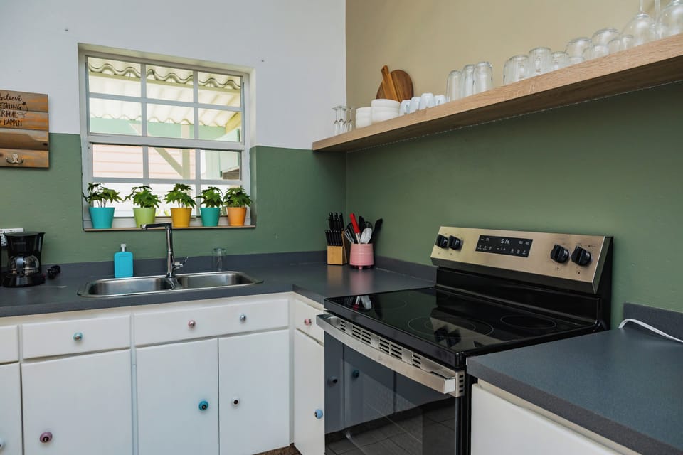 Kitchen close-up showing modern finishes and glassware setup