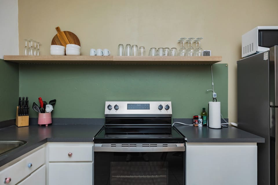 Modern stove with open shelving and essentials