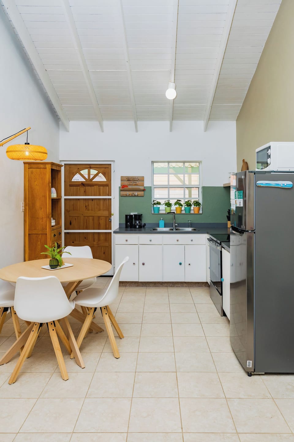 Cozy dining and kitchen area with warm natural tones