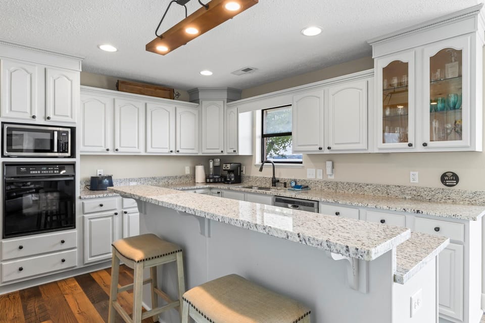 The kitchen has lots of counter space, including an eat at bar