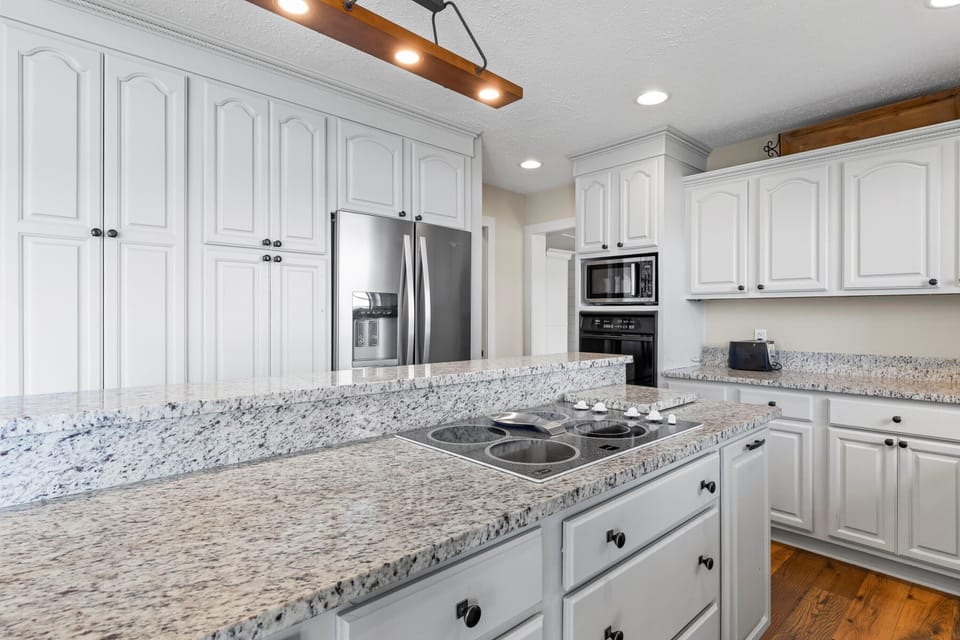 The kitchen has lots of counter space, including an eat at bar