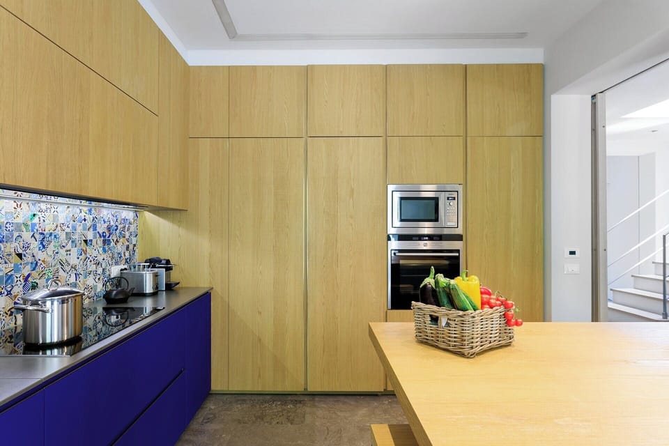 The contemporary kitchen with its central island.