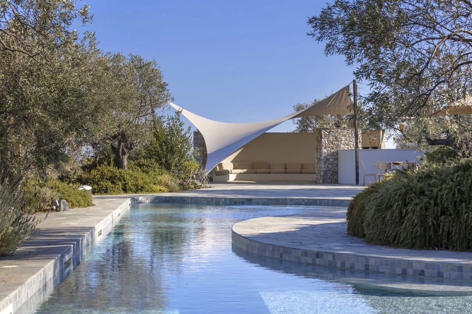 Relaxing down by Adelphia's extraordinary, 25m-long pool.
