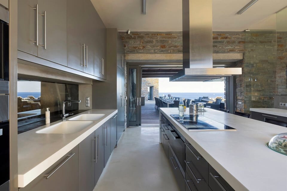 The kitchen opens out directly onto the main al fresco dining terrace.