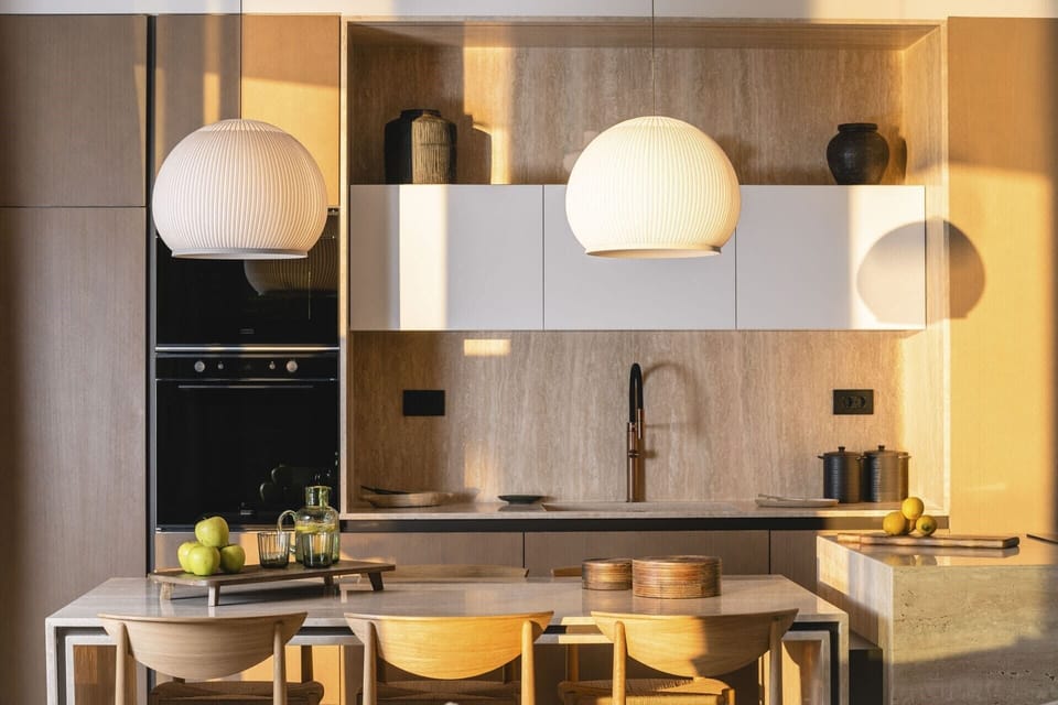 The sleek contemporary kitchen and dining area.