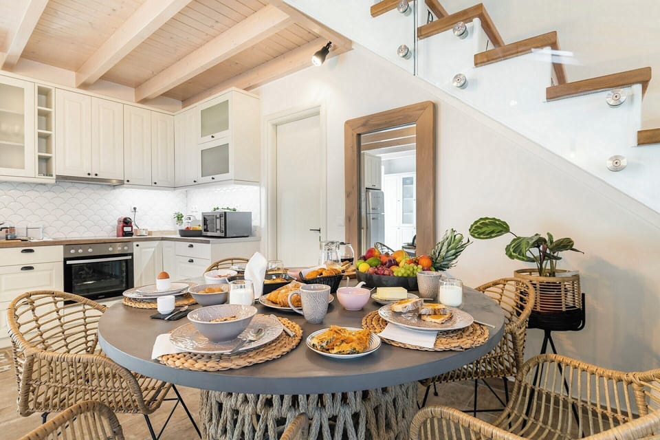 The dining area with the kitchen behind.