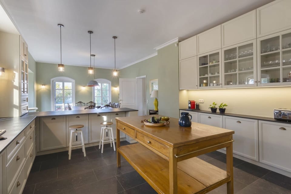 The spacious, well-equipped and charming kitchen in the main house.
