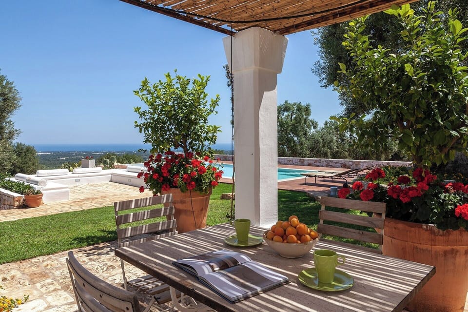The shaded al fresco dining area overlooking the pool.