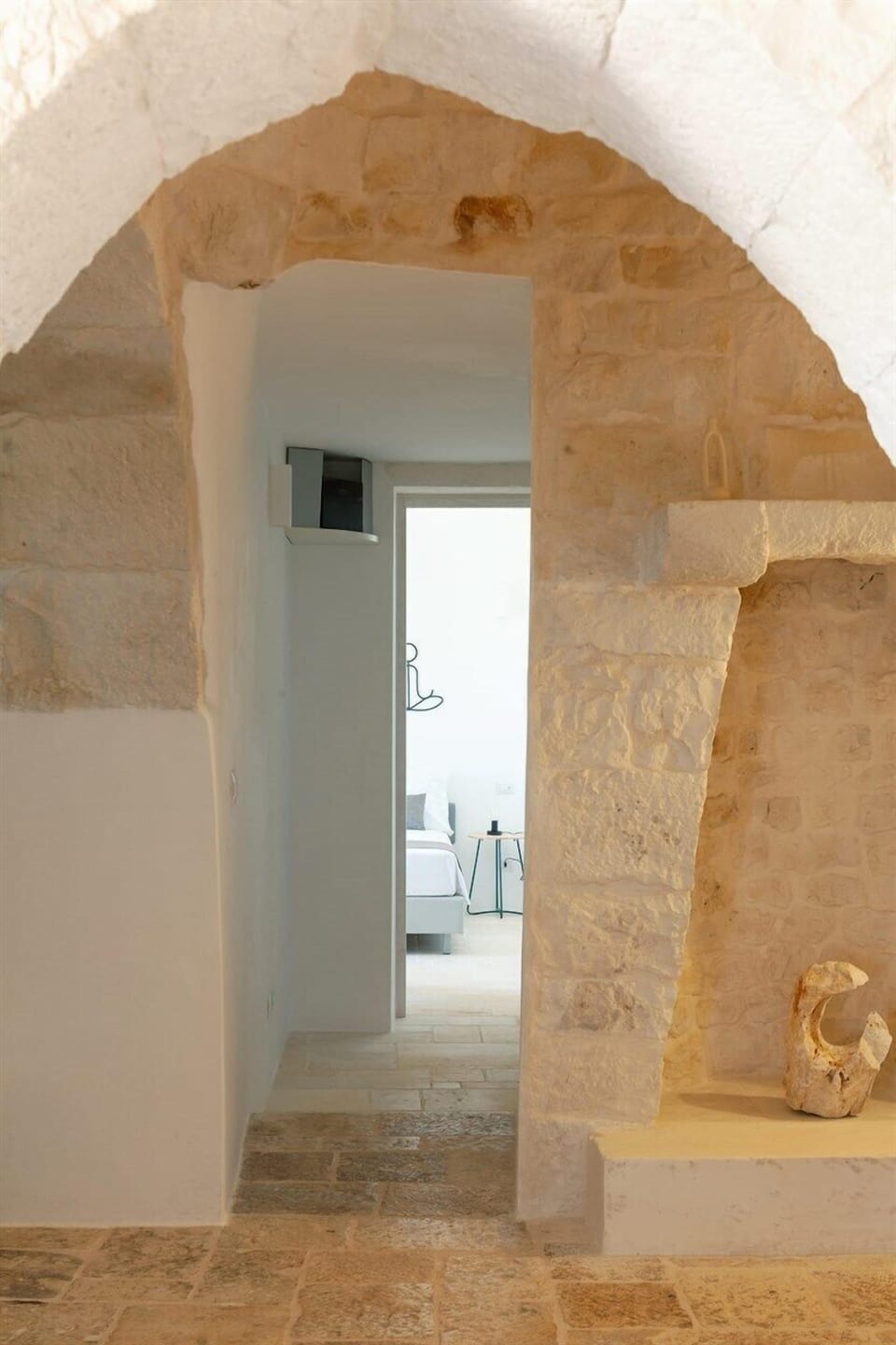 Looking through from the trulli to the lamia, two distinct Puglian agricultural constructions.
