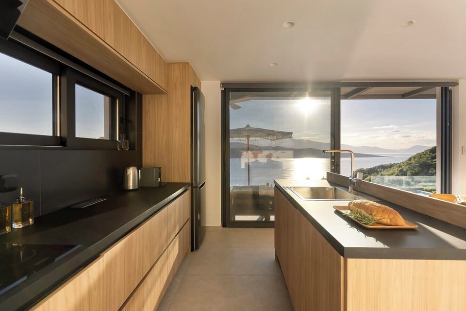 The sleek contemporary kitchen with its fabulous sea views.