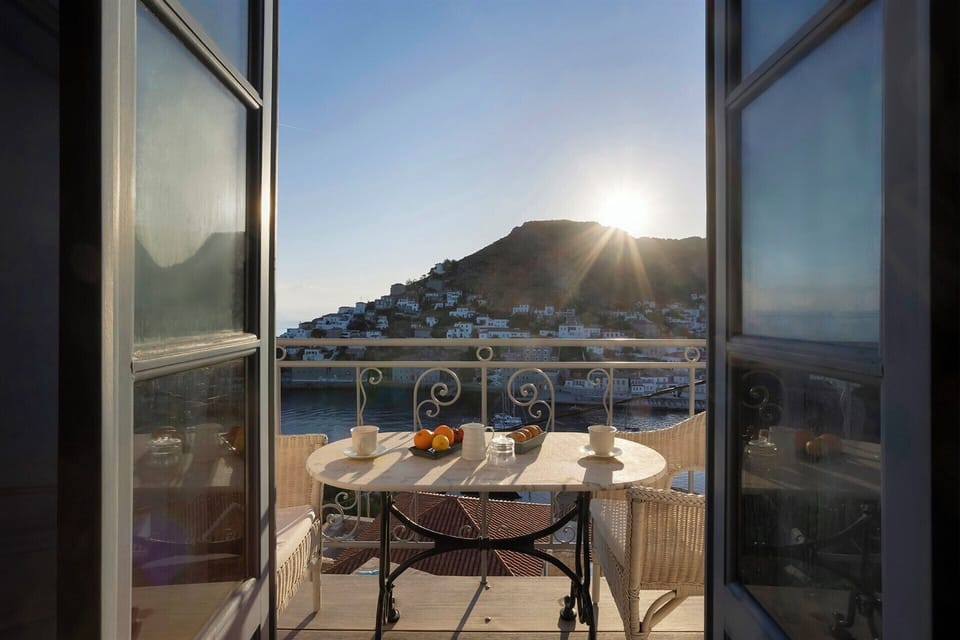 An early breakfast as the sun comes up over Hydra Port.